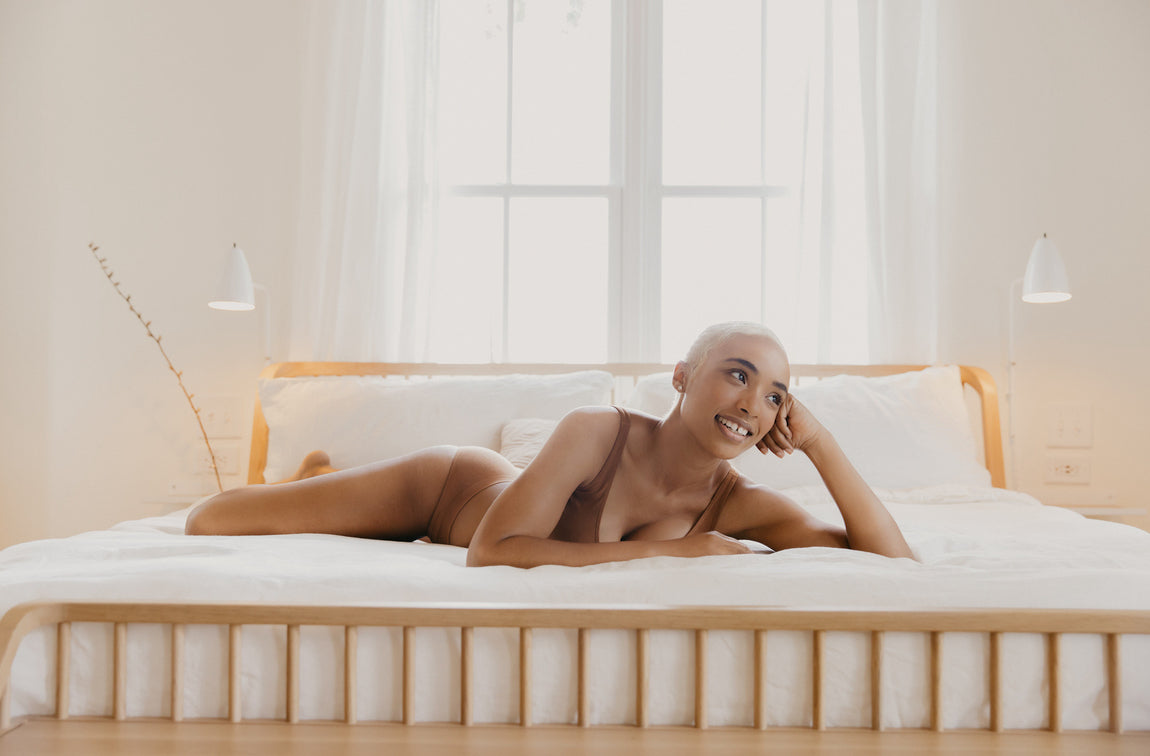 Woman in underwear lying on the bed