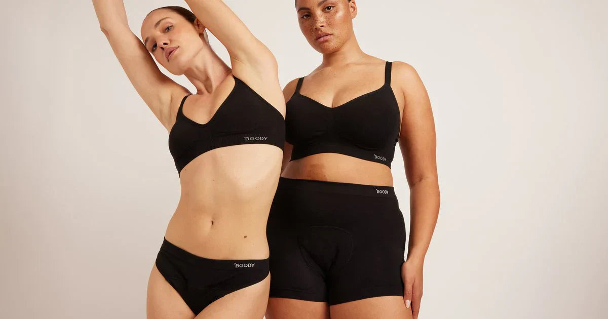 Models wearing black Boody bamboo period underwear and soft bras, highlighting breathable bamboo fabric and reusable period protection.