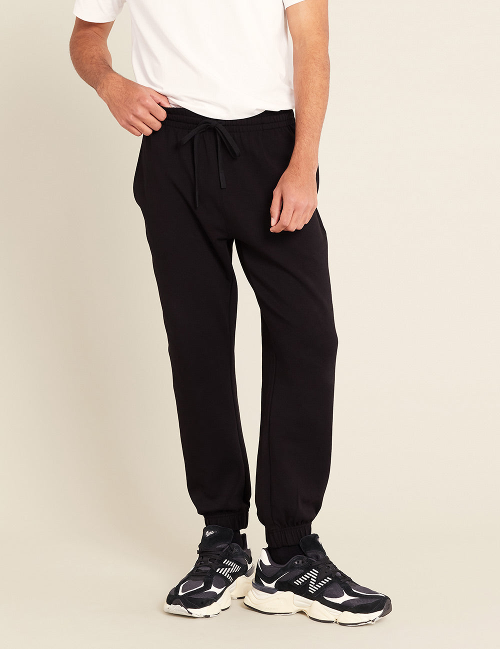 Gender-Neutral-Cuffed-Sweat-Pants-Black-Male-Front.jpg